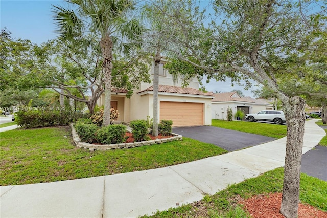 1326 Majesty Ter, Weston, FL 33327 - view of front of house with stucco siding, driveway, a tiled roof, a front lawn, and a garage
