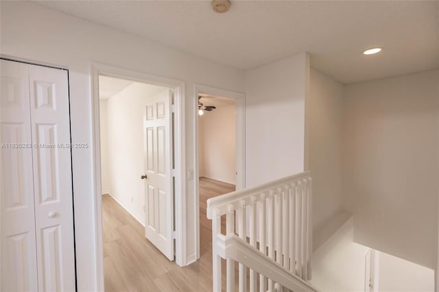 1326 Majesty Ter, Weston, FL 33327 - corridor featuring an upstairs landing, light wood-style flooring, and recessed lighting