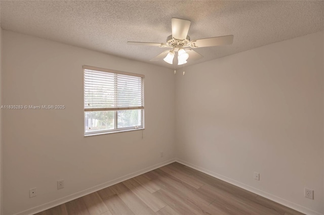 1326 Majesty Ter, Weston, FL 33327 - unfurnished room with wood finished floors, a textured ceiling, and ceiling fan