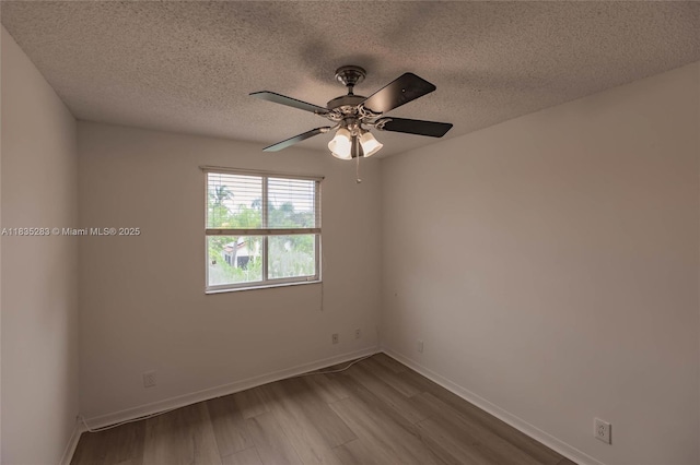 1326 Majesty Ter, Weston, FL 33327 - unfurnished room with wood finished floors, a textured ceiling, and a ceiling fan