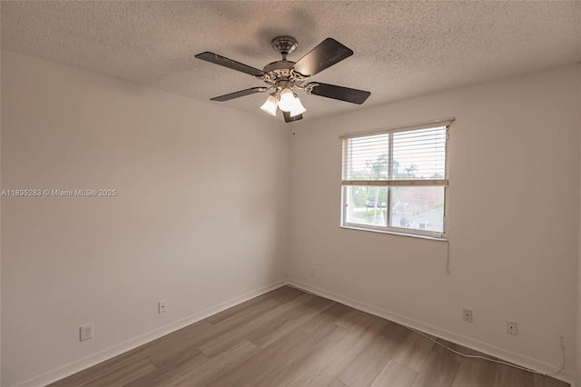 1326 Majesty Ter, Weston, FL 33327 - spare room with wood finished floors, a textured ceiling, and a ceiling fan