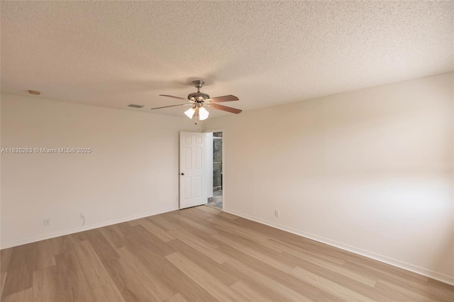 1326 Majesty Ter, Weston, FL 33327 - unfurnished room featuring light wood finished floors, ceiling fan, and a textured ceiling