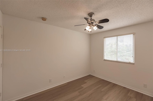 1326 Majesty Ter, Weston, FL 33327 - unfurnished room with dark wood finished floors, a textured ceiling, ceiling fan, and a smoke detector