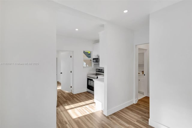 1260 SW 4th St, Miami, FL 33135 - corridor featuring light wood-type flooring and recessed lighting