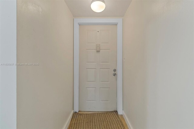 1001 Colony Point Cir Unit 419, Pembroke Pines, FL 33026 - doorway to outside with baseboards