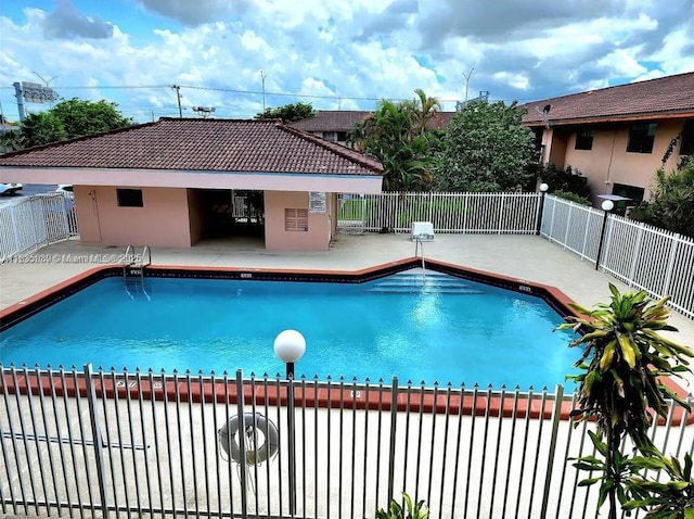 5851 W 20th Ave Unit 412, Hialeah, FL 33012 - community pool featuring a patio