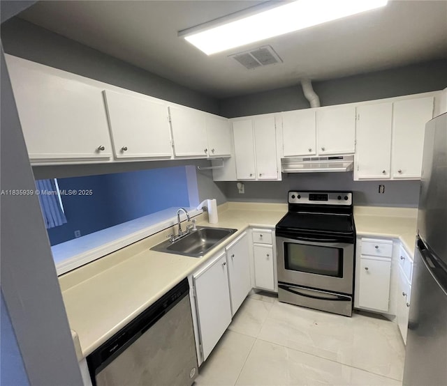 5851 W 20th Ave Unit 412, Hialeah, FL 33012 - kitchen featuring stainless steel appliances, white cabinetry, and light countertops