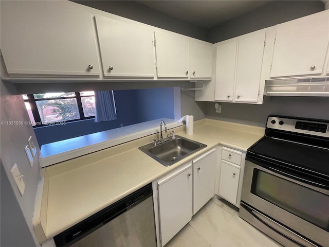 5851 W 20th Ave Unit 412, Hialeah, FL 33012 - kitchen with stainless steel appliances, under cabinet range hood, light countertops, and white cabinetry