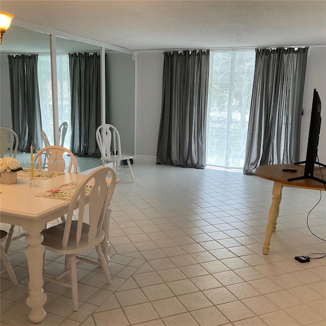 9201 Sunrise Lakes Blvd Unit 205, Sunrise, FL 33322 - dining area with a wall of windows and light tile patterned floors