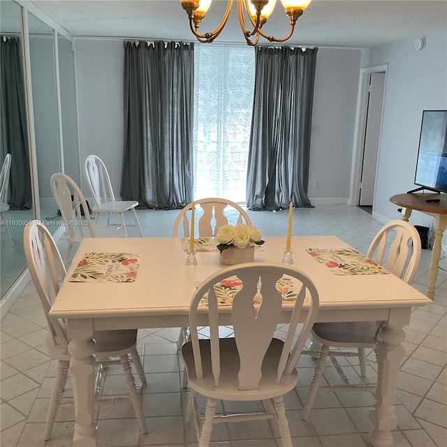 9201 Sunrise Lakes Blvd Unit 205, Sunrise, FL 33322 - dining area featuring a chandelier and baseboards