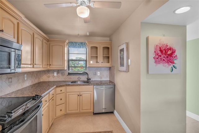 2430 Deer Creek Country Club Blvd Unit 304-2, Deerfield Beach, FL 33442 - kitchen featuring appliances with stainless steel finishes, decorative backsplash, a ceiling fan, and light brown cabinets