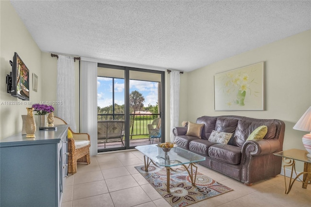 2430 Deer Creek Country Club Blvd Unit 304-2, Deerfield Beach, FL 33442 - living area with a textured ceiling and light tile patterned floors