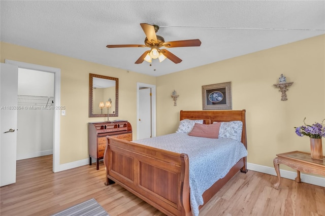 2430 Deer Creek Country Club Blvd Unit 304-2, Deerfield Beach, FL 33442 - bedroom featuring light wood-type flooring and a ceiling fan