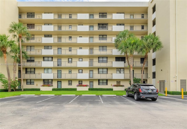 2430 Deer Creek Country Club Blvd Unit 304-2, Deerfield Beach, FL 33442 - view of apartment building / complex featuring uncovered parking