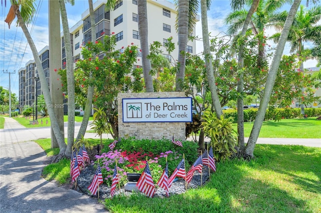 2430 Deer Creek Country Club Blvd Unit 304-2, Deerfield Beach, FL 33442 - community sign featuring a yard