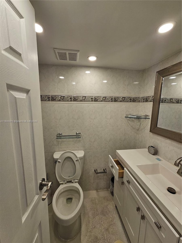 200 172nd St Unit 217, Sunny Isles Beach, FL 33160 - bathroom with vanity, tile walls, and recessed lighting