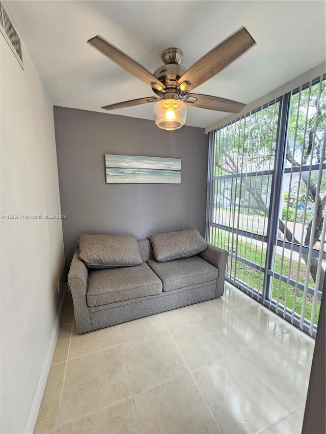 200 172nd St Unit 217, Sunny Isles Beach, FL 33160 - tiled living room featuring ceiling fan and baseboards