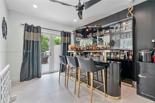 217 SW 11th St, Fort Lauderdale, FL 33315 - indoor dry bar with french doors, a ceiling fan, and recessed lighting