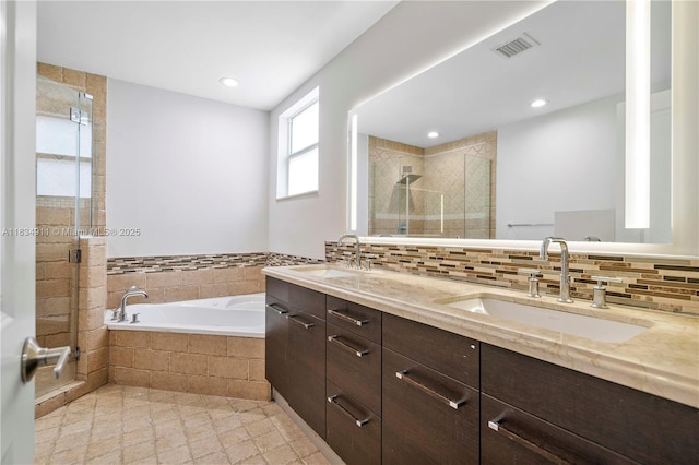 217 SW 11th St, Fort Lauderdale, FL 33315 - bathroom with a garden tub, a shower stall, double vanity, decorative backsplash, and recessed lighting