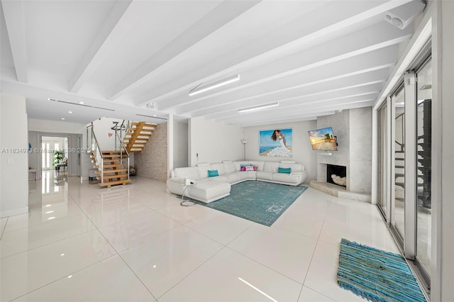1930 NE 193rd St, Miami, FL 33179 - living room with stairs, tile patterned floors, beamed ceiling, and a high end fireplace
