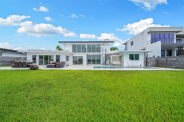 1930 NE 193rd St, Miami, FL 33179 - back of property with an outdoor hangout area, an outdoor pool, a patio area, and stucco siding