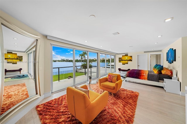 1930 NE 193rd St, Miami, FL 33179 - living room with a water view, light wood-type flooring, and recessed lighting