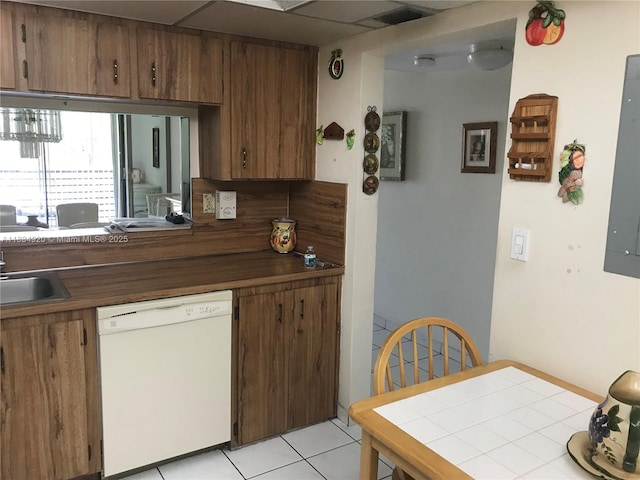 1101 Colony Point Cir Unit 206, Pembroke Pines, FL 33026 - kitchen featuring dishwasher, brown cabinets, light tile patterned floors, and electric panel