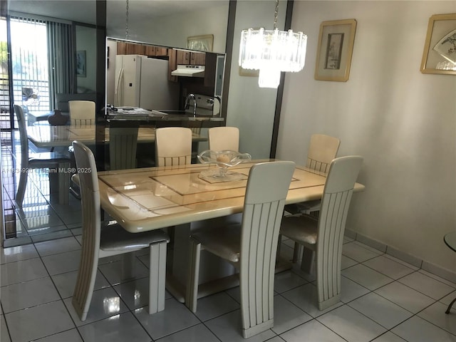 1101 Colony Point Cir Unit 206, Pembroke Pines, FL 33026 - dining space with light tile patterned floors and a chandelier