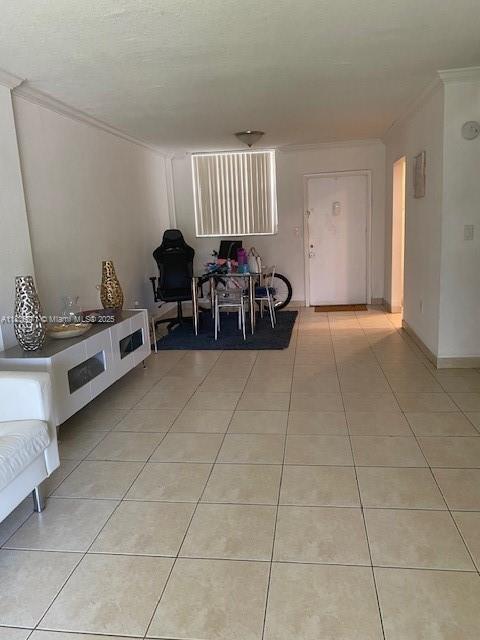 14150 SW 84th St Unit 201-I, Miami, FL 33183 - living room with crown molding and light tile patterned flooring