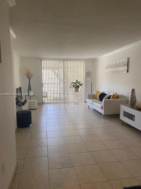 14150 SW 84th St Unit 201-I, Miami, FL 33183 - living area with ornamental molding and light tile patterned floors