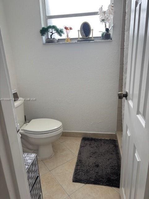 14150 SW 84th St Unit 201-I, Miami, FL 33183 - bathroom with healthy amount of natural light and tile patterned floors
