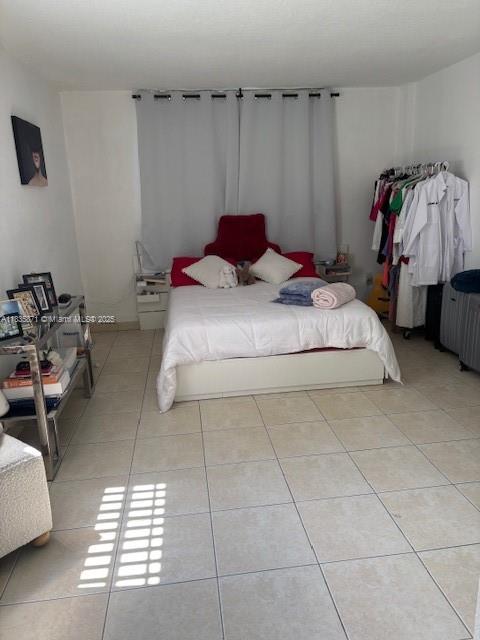 14150 SW 84th St Unit 201-I, Miami, FL 33183 - bedroom with light tile patterned flooring