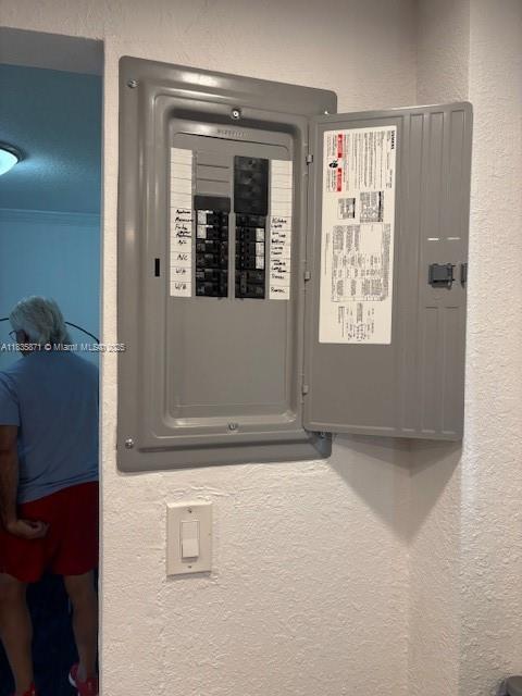 14150 SW 84th St Unit 201-I, Miami, FL 33183 - utility room featuring electric panel