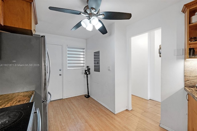 1660 NE 191st St Unit 206-1, Miami, FL 33179 - kitchen featuring freestanding refrigerator, light wood-type flooring, a ceiling fan, brown cabinetry, and range with electric stovetop