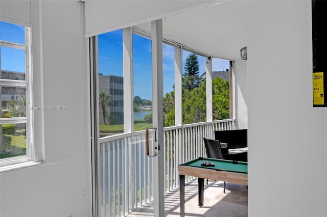 1660 NE 191st St Unit 206-1, Miami, FL 33179 - unfurnished sunroom with a water view, plenty of natural light, and pool table