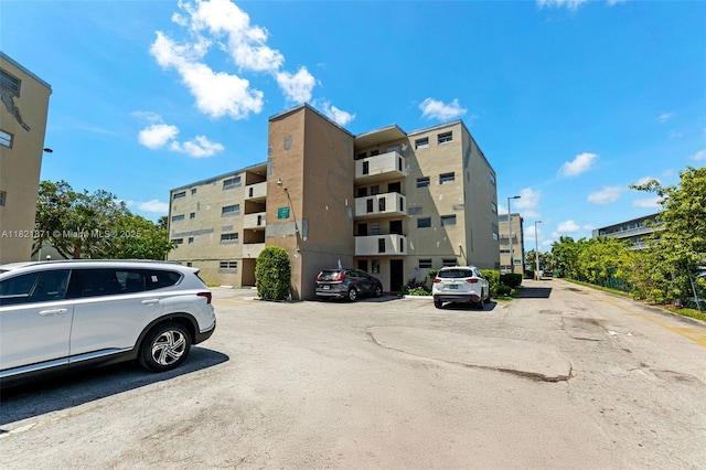 1660 NE 191st St Unit 206-1, Miami, FL 33179 - view of apartment building / complex with uncovered parking