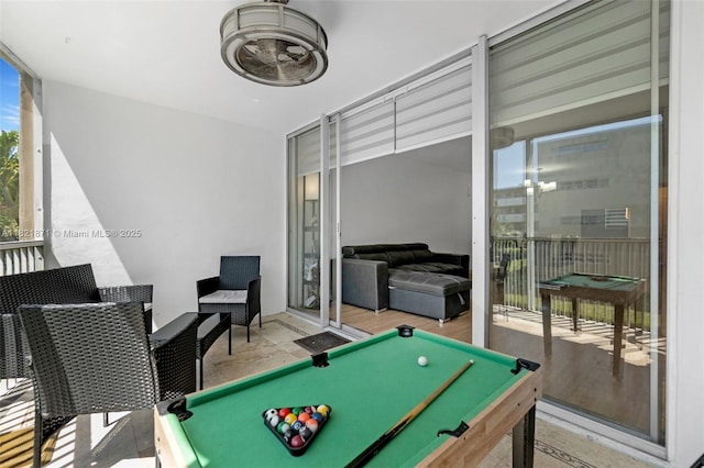 1660 NE 191st St Unit 206-1, Miami, FL 33179 - rec room with expansive windows, billiards, and wood finished floors