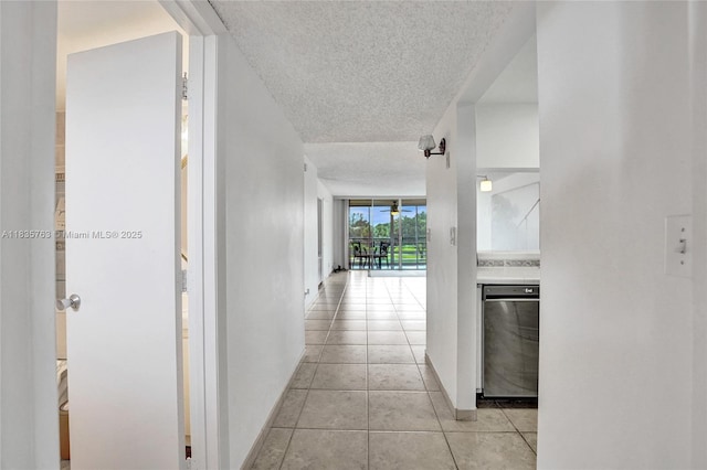 1911 Sabal Palm Dr Unit 304, Davie, FL 33324 - hall with a textured ceiling and light tile patterned floors