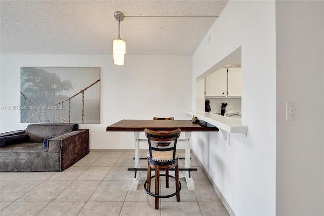 1911 Sabal Palm Dr Unit 304, Davie, FL 33324 - dining space featuring a textured ceiling and light tile patterned floors