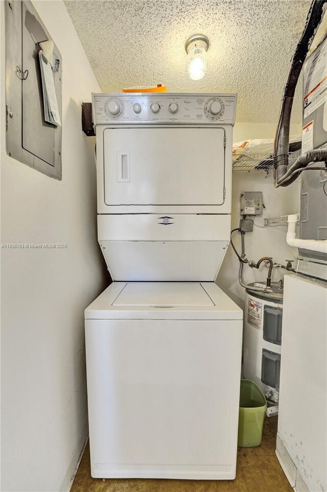 1911 Sabal Palm Dr Unit 304, Davie, FL 33324 - laundry room featuring stacked washing machine and dryer, water heater, a textured ceiling, and electric panel
