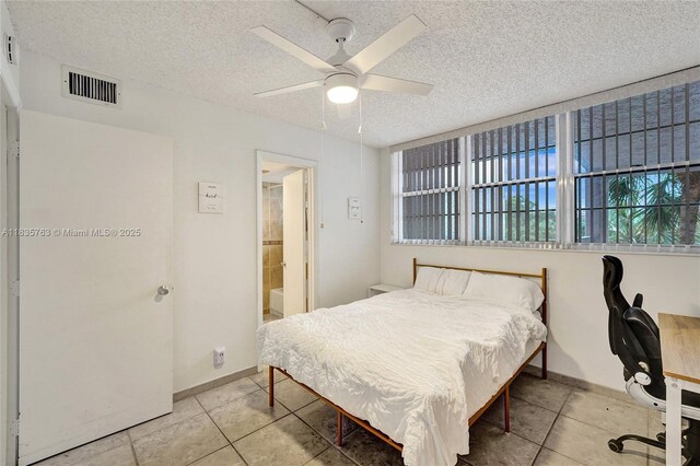 1911 Sabal Palm Dr Unit 304, Davie, FL 33324 - bedroom with tile patterned floors, a textured ceiling, and a ceiling fan