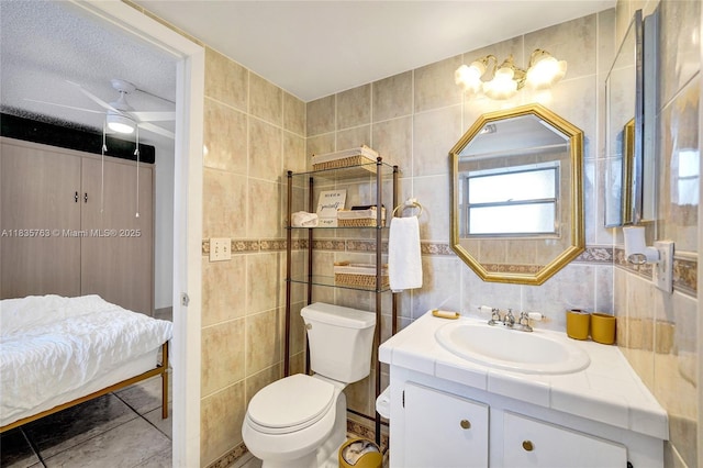 1911 Sabal Palm Dr Unit 304, Davie, FL 33324 - bathroom featuring tile walls, vanity, ceiling fan, and tile patterned floors