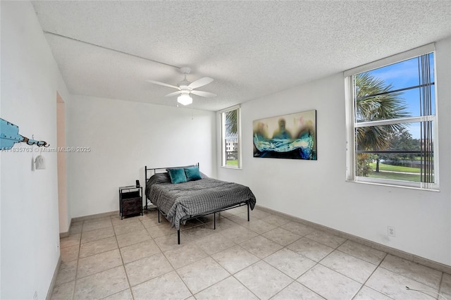 1911 Sabal Palm Dr Unit 304, Davie, FL 33324 - bedroom with a textured ceiling, ceiling fan, and light tile patterned floors
