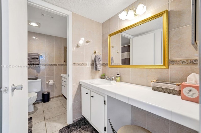1911 Sabal Palm Dr Unit 304, Davie, FL 33324 - bathroom with tile walls, vanity, tile patterned floors, and a textured ceiling