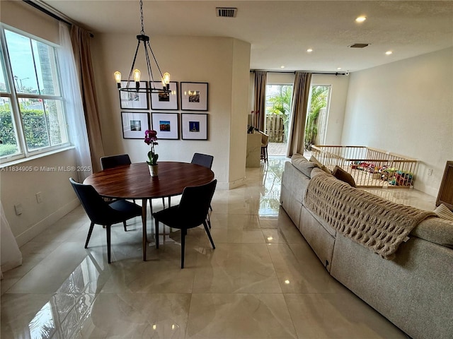 14902 SW 23rd Way, Miami, FL 33185 - dining space with a chandelier, healthy amount of natural light, light marble finish flooring, and recessed lighting