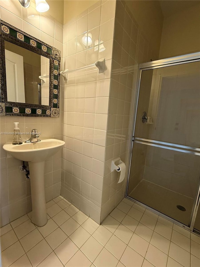 14902 SW 23rd Way, Miami, FL 33185 - full bathroom featuring a stall shower, tile patterned floors, and tile walls