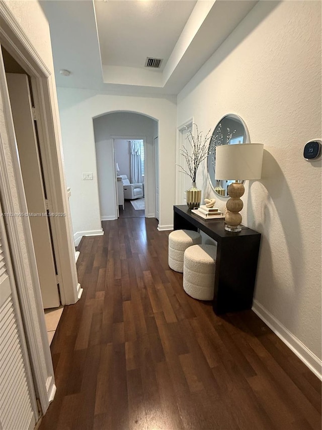 14902 SW 23rd Way, Miami, FL 33185 - corridor with arched walkways, a raised ceiling, and wood finished floors