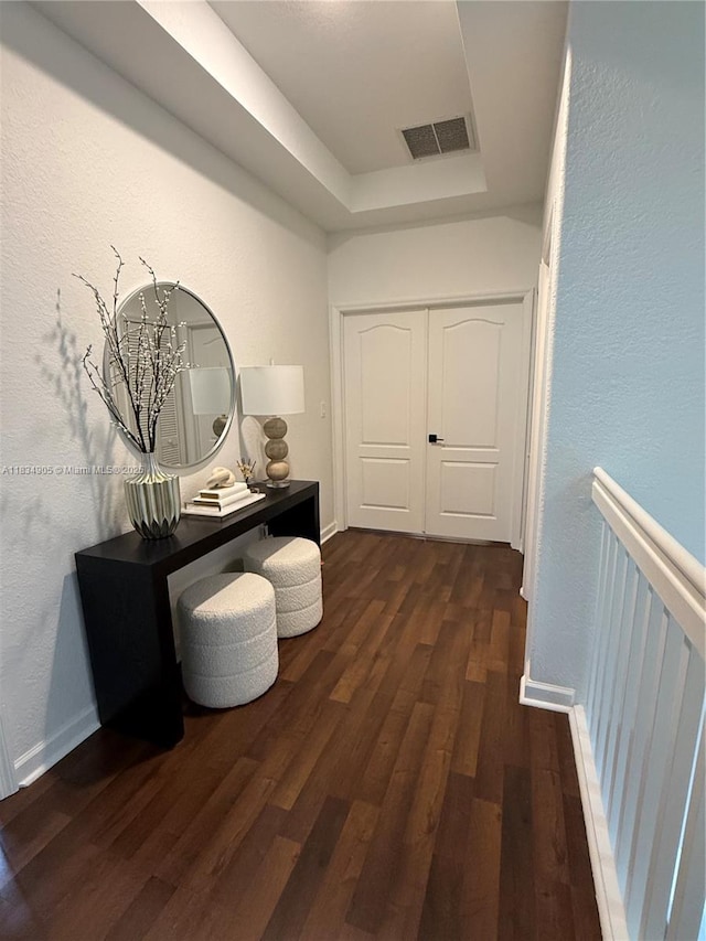 14902 SW 23rd Way, Miami, FL 33185 - corridor featuring dark wood-style floors, a tray ceiling, and a textured wall