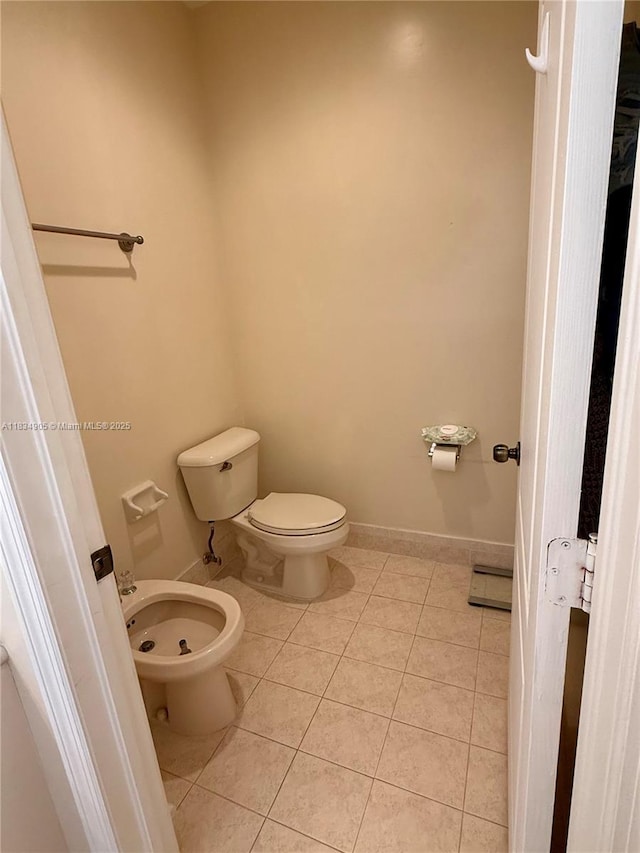 14902 SW 23rd Way, Miami, FL 33185 - bathroom featuring tile patterned floors and a bidet