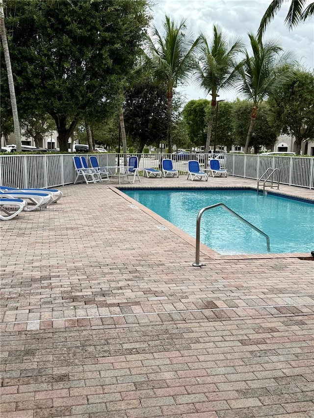 14902 SW 23rd Way, Miami, FL 33185 - community pool featuring a patio